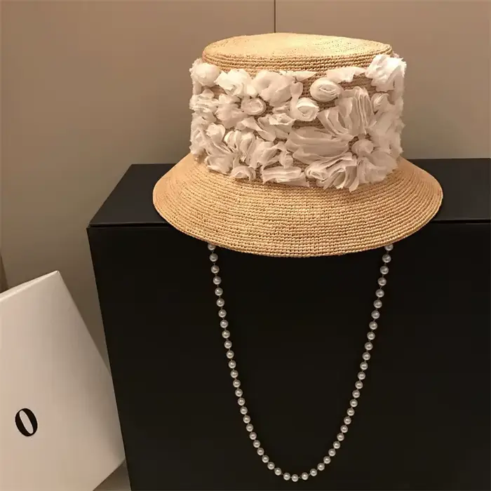 202606-hh5236A Nouveauté chapeau bob décontracté en raphia naturel avec ruban floral et chaîne de perles pour homme et